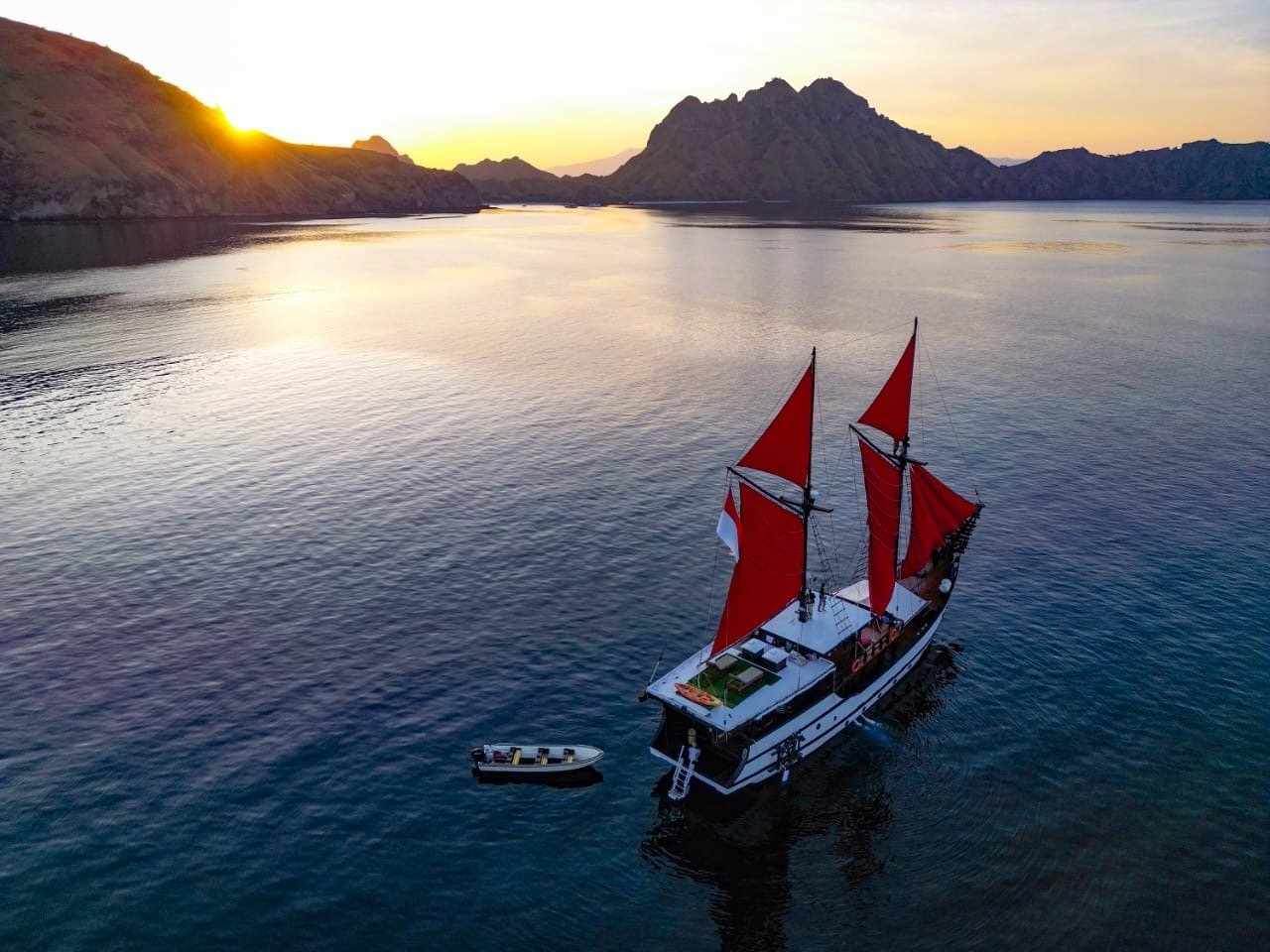 Traditional phinisi sailing through Raja Ampat