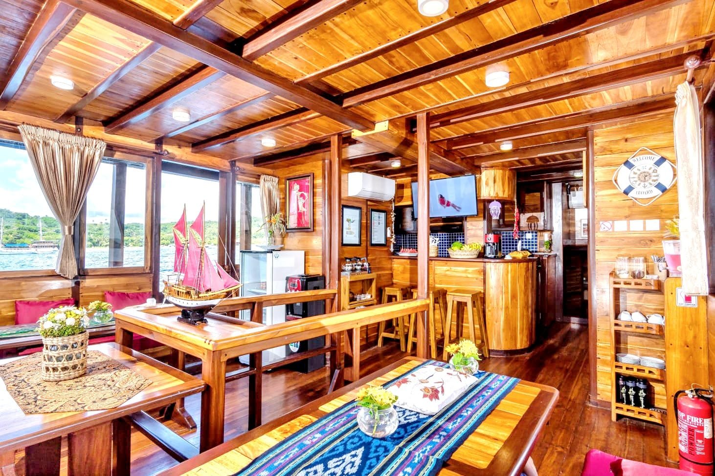 Indoor lounge and dining area aboard Supraba